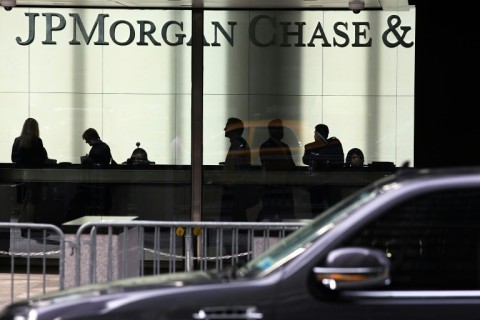 JPMorgan Chase reported lower quarterly profits as it set aside more funds in case of bad loans