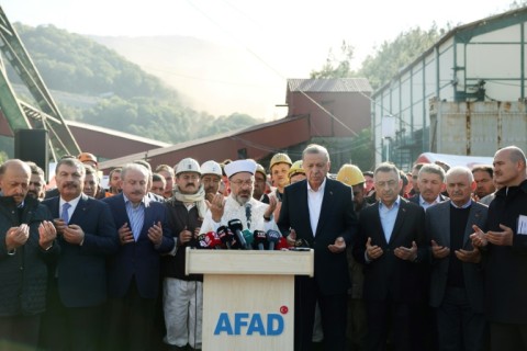 President Recep Tayyip Erdogan prays for the 41 dead miners at the pit near Amasra on Turkey's Black Sea coast