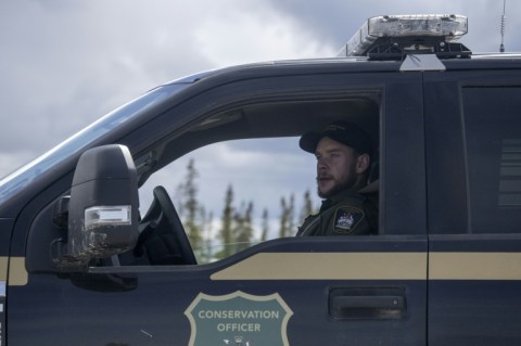 Provincial polar bear patrol officer Ian Van Nest surveys the Hudson Bay shoreline outside the town of Churchill