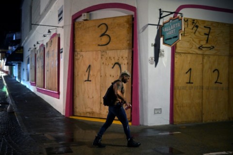 Businesses in the tourist area of Puerto Vallarta in Jalisco state, Mexico, boarded up shopfronts in preparation for Hurricane Roslyn's landfall