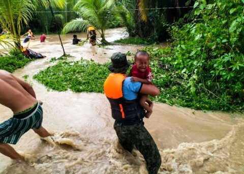 Tropical Storm Nalgae has unleashed flash floods and landslides in parts of the Philippines