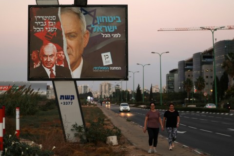 Israeli far-right lawmaker and leader of the Otzma Yehudit (Jewish Power) party Itamar Ben-Gvir speaks to the press after casting his vote at a polling station in the West Bank town of Hebron