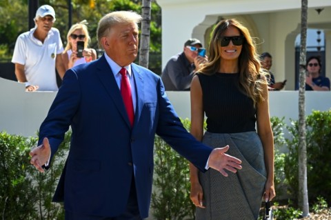 Former US President Donald Trump and his wife, Melania Trump, speak to reporters after voting in Palm Beach, Florida