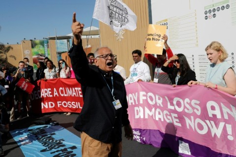 Climate activists stage a protest outside the Sharm el-Sheikh International Convention Centre on Friday