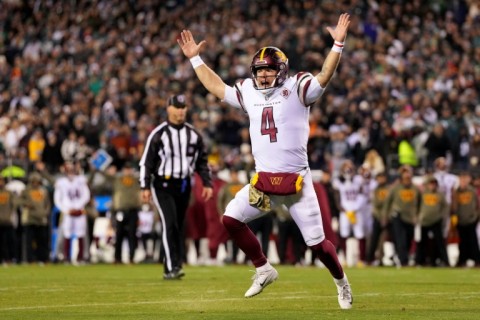 Washington quarterback Taylor Heinicke celebrates a Commanders touchdown as his team upset previously unbeaten Philadelphia 32-21 in Monday's NFL game