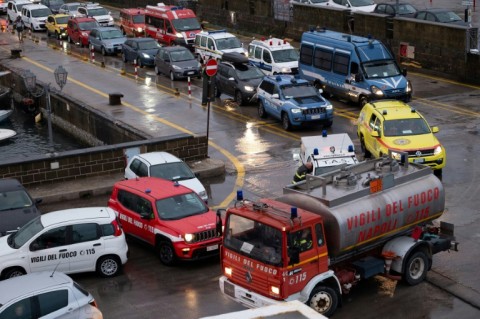 The rescue effort was hampered by continued rain and high winds, which also delayed ferries bringing reinforcements from the mainland