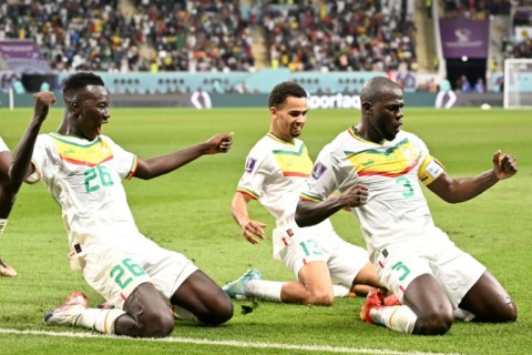 Kalidou Koulibaly (R) sent his team into the World Cup last 16 with his winner over Ecuador