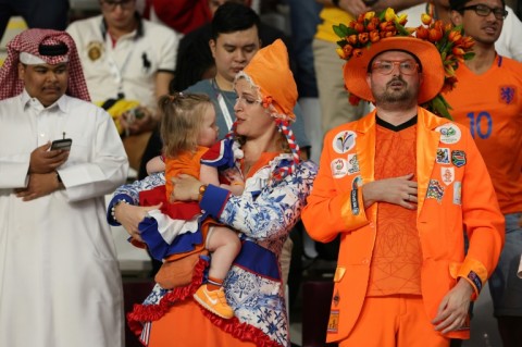 A family of Dutch supporters before their game versus in the US in Qatar