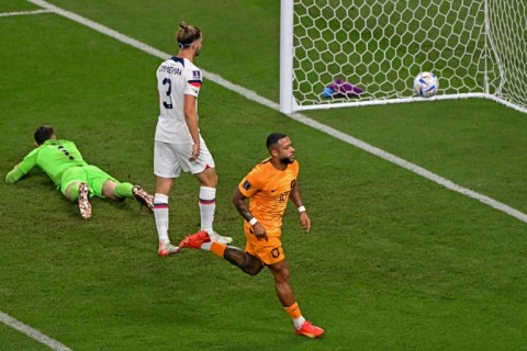 Memphis Depay celebrates after firing the Netherlands into the lead in their World Cup last 16 victory over the United States