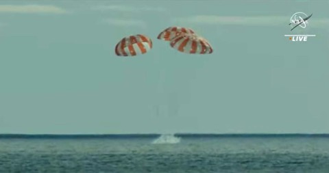 NASA's Orion space capsule, photographed at more than 432,000 km (268,000 miles) from Earth, a record for a habitable vessel, with our planet and the Moon in the background, in November 2022 