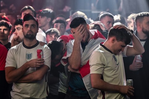 England fans in Manchester are despondent after France open the scoring in the World Cup quarter-final