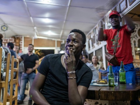 Morocco supporters react while watching a live broadcast of the semi-final match between Morocco and France in Central African Republic