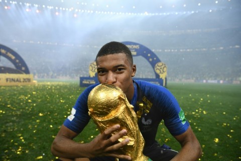 Kylian Mbappe kisses the World Cup trophy after France beat Croatia 4-2 in the 2018 final in Moscow