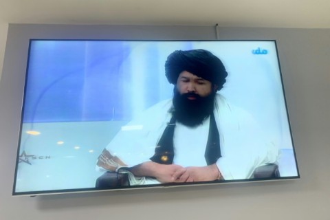 Neda Mohammad Nadeem, the minister of higher education for Afghanistan, speaks in a live television broadcast  in Kabul as he explains the Taliban's decision to bar women from universities