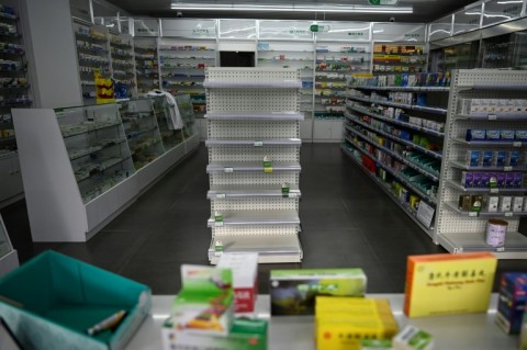 Empty shelves at a pharmacy in Beijing. Cities have been struggling to cope with surging infections since China dropped its zero-Covid policy