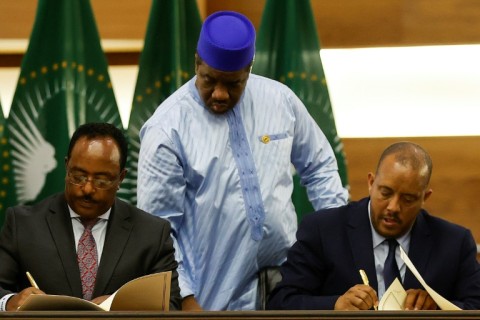 Peace deal: Ethiopian government representative Redwan Hussein, left, and Tigray's Getachew Reda at the November 2 signing ceremony in Pretoria