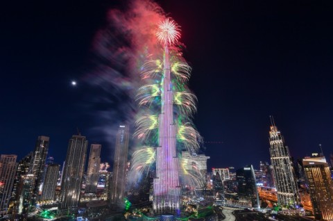 New Year's Eve fireworks light the landmark Burj Khalifa tower at midnight in the Gulf emirate of Dubai on December 31, 2022