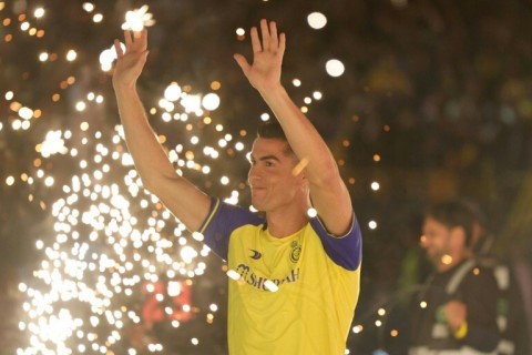 Al-Nassr's new Portuguese forward Cristiano Ronaldo greets fans during his unveiling at the Mrsool Park Stadium in Riyadh