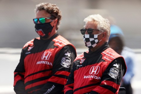 Mario Andretti and his son Michael stand on the grid prior to the 104th running of the Indianapolis 500 at Indianapolis Motor Speedway in August 2020