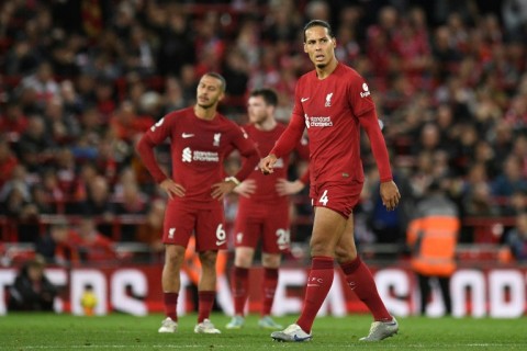 Injured - Liverpool defender Virgil van Dijk (R) 