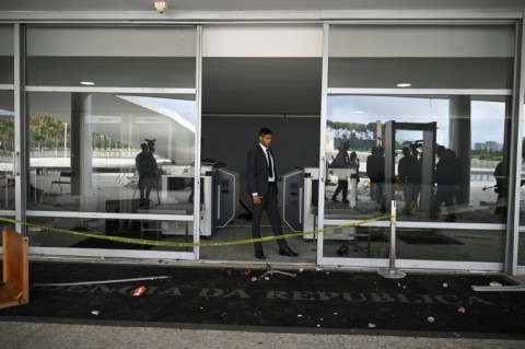 A security officer stands inside the pillaged Planalto presidential palace in Brasilia, a day after supporters of Brazil's far-right ex-president Jair Bolsonaro invaded the building, as well as Congress and the Supreme Court