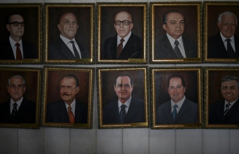 Paintings of Brazilian Senate presidents over the years, vandalized after a far-right mob invaded government buildings in Brasilia 