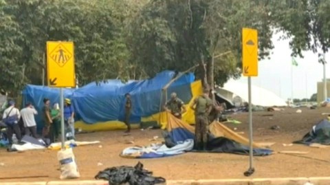 Soldiers dismantle the camp set up by far-right supporters of Brazil's ex-president Jair Bolsonaro in front of the Army headquarters in Brasilia