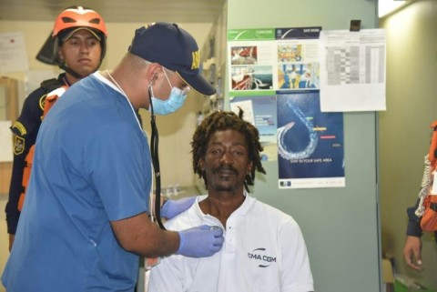 Elvis Francois, shown here being checked by a doctor after his rescue on the Caribbean Sea, says he survived 24 days living on ketchup, stock cubes and garlic powder