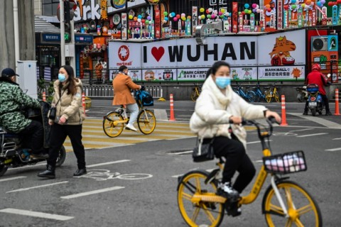 Wuhan, the Chinese city synonymous with with Covid-19, springs back to life for Lunar New Year's Eve, but many are mourning family members lost during the pandemic