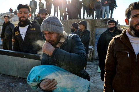 A woman is rescued after surviving the earthquake in the hard-hit Hatay province in Turkey 