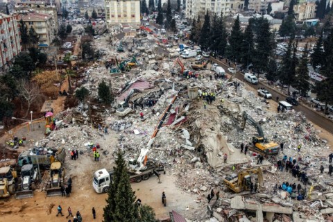 Rescue workers look for survivors in the rebel-held town of Jindayris in Syria