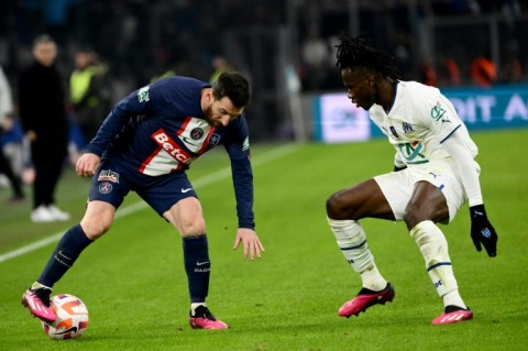 Lionel Messi (L) in action for PSG against Marseille in the French Cup on Wednesday