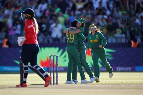 On our way: South Africa's Ayabonga Khaka (2nd left) celebrates after the dismissal of England's Sophie Ecclestone 