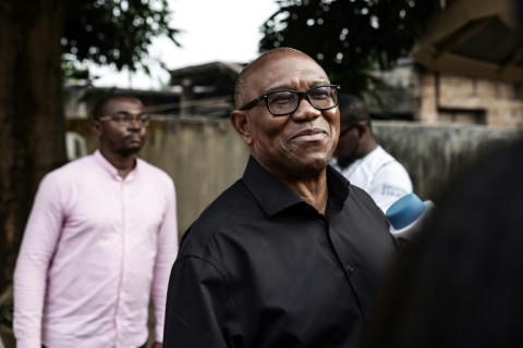 Labour Party presidential candidate Peter Obi (C) attracted new voters with a message of change