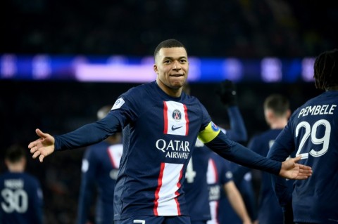 Kylian Mbappe celebrates after netting his 201st goal for PSG against Nantes to become the club's all-time top scorer