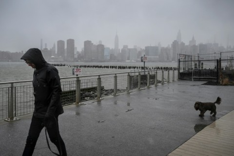 Rain and snow pummeled New York City as a storm gripped the US East Coast