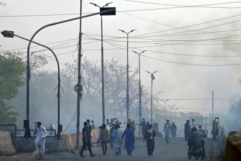 Vehicles set ablaze after a clash between police and supporters of former Pakistan prime minister Imran Khan in Lahore