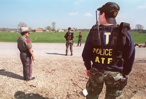 Agents from the Bureau of Alcohol, Tobacco and Firearms (ATF) and local Texan authorities are shown in March 1993 near the Branch Davidian compound in Waco, Texas