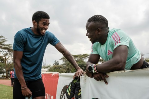 Sharry Dodin (L) soaks up the advice from Commonwealth 100m champion Ferdinand Omanyala after training in Nairobi