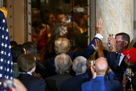 A photo shows former US President Donald Trump appearing before a New York judge to be arraigned on criminal charges