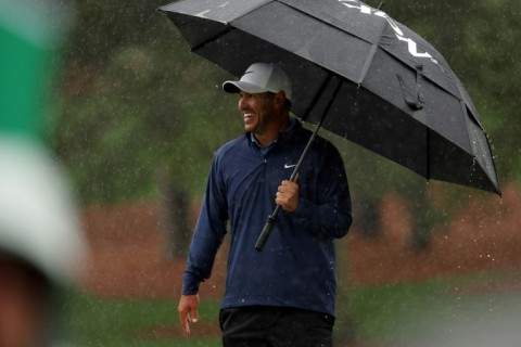 Brooks Koepka held a four-stroke lead at the Masters before rain stopped third-round play on Saturday