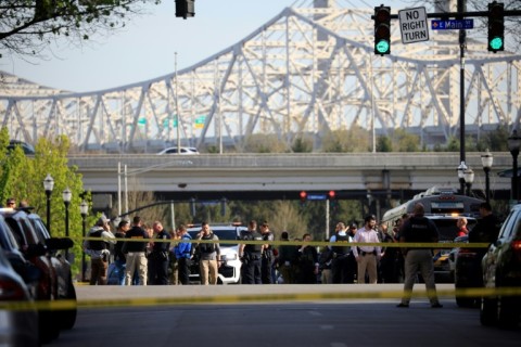 Law enforcement officers respond to an active shooter near the Old National Bank building in Louisville, Kentucky