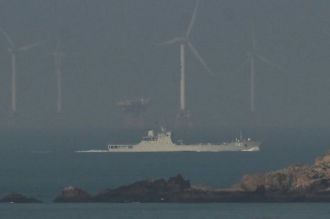 A Chinese navy ship seen off Pingtan island close to Taiwan on Monday. China's military said it had 'successfully completed' its drills around Taiwan