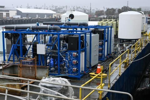 At the port of Los Angeles, a strange-looking barge covered with pipes and tanks contains a concept that hopes to help tackle global warming 