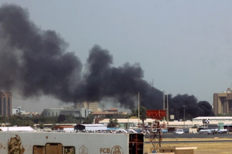 Smoke rises above buildings in Khartoum as the regular army battles paramilitaries at multiple locations around the Sudanese capital