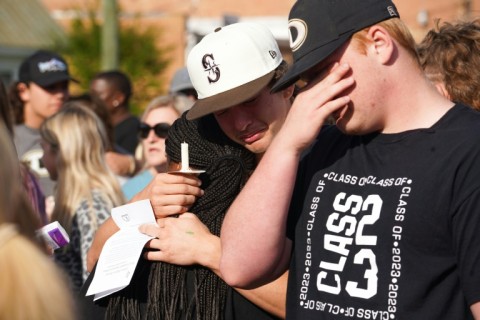 Mourners attend a vigil outside a church in Dadeville, Alabama on April 16, 2023, the day after a mass shooting at a teen's birthday party left four people dead and 28 others injured