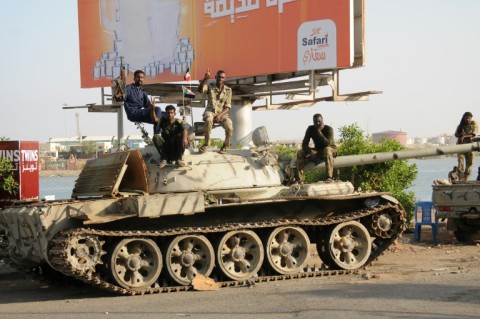 South Korean diplomats who fled the violence in Sudan disembark from a military plane in Jeddah, Saudi Arabia