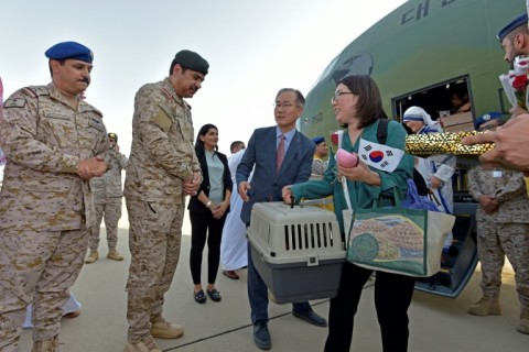 South Korean diplomats who fled the violence in Sudan disembark from a military plane in Jeddah, Saudi Arabia