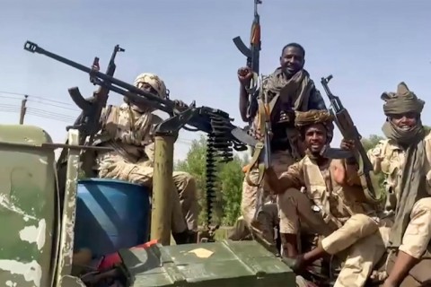 Fighters of Sudan's paramilitary Rapid Support Forces (RSF) patrol the streets in the East Nile district of greater Khartoum