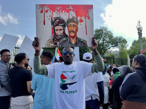 Activists demonstrate in front of the White House, calling on the US to intervene to stop the fighting in Sudan